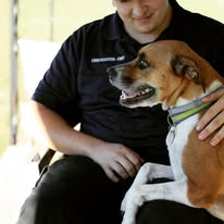 Portrait — person in uniform with a dog