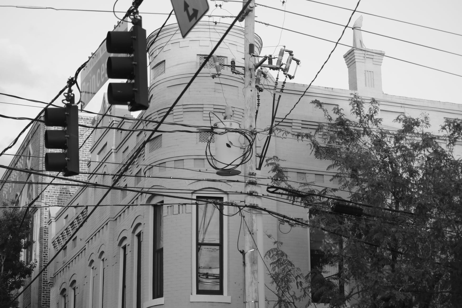 Historic corner building — black and white
